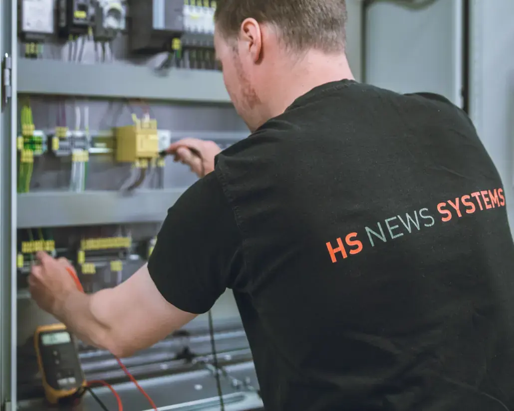 HS technician testing an electrical control board